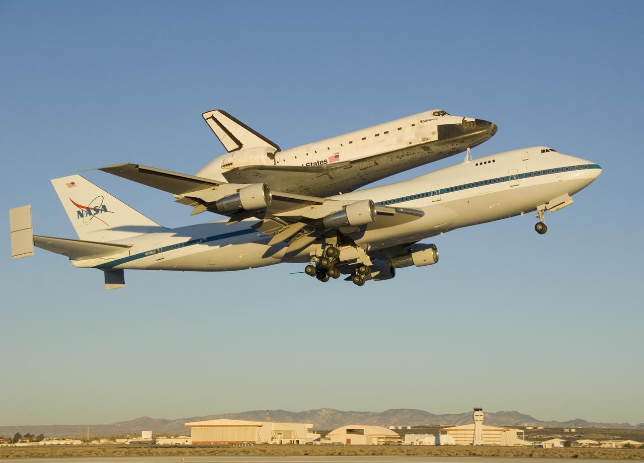 The Space Shuttle Endeavour atop its modified Boeing 747 carrier aircraft lifts off from Edwards Air Force Base on the first leg of its ferry flight back to the Kennedy Space Center just after sunrise on Dec. 10, 2008.