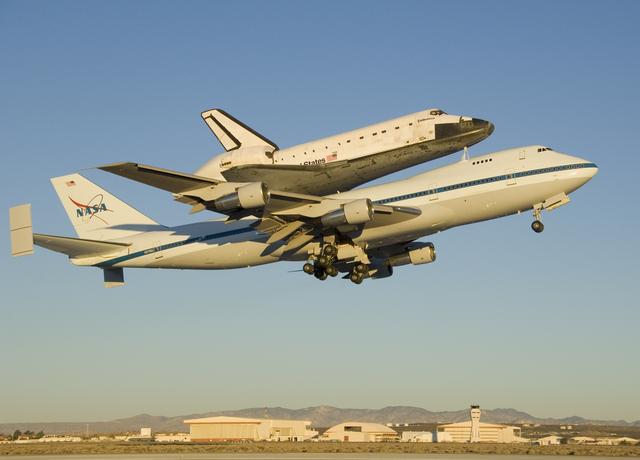 NASA image: The modified 747 carrier aircraft carrying the Space Shuttle Endeavour soars aloft from Edwards AFB on the first leg of its ferry flight back to Florida