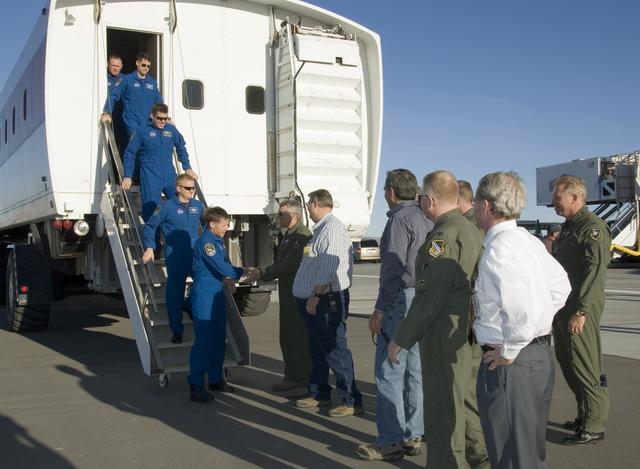 NASA image: Air Force and NASA officials greet the STS-126 crew as they exit the Crew Transport Vehicle after landing the shuttle Endeavour at Edwards Air Force Base