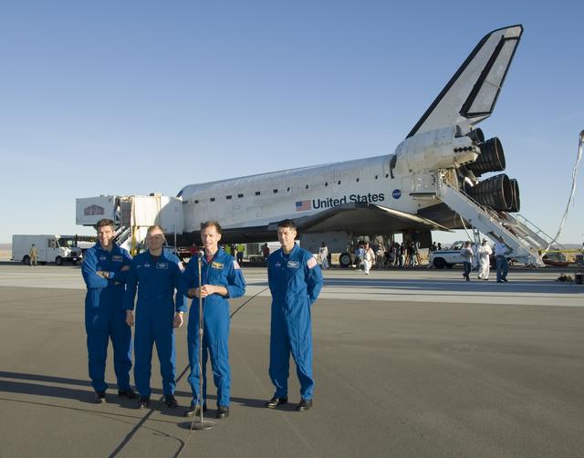 NASA image: STS-126 commander Chris Ferguson, flanked by crewman Stephen Bowen, Eric Boe and Robert Kimbrough, offers comments on the mission after landing at Edwards AFB