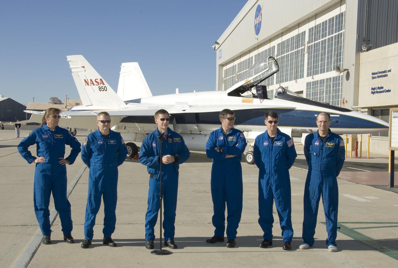 With a NASA F/A-18 providing a backdrop, STS-126 commander Chris Ferguson thanked NASA Dryden Flight Research Center employees for their support of Space Shuttle Endeavour's landing at Edwards Air Force Base Nov. 30, 2008. Flanking Ferguson were STS-126 crewmembers (from left) Heidimarie Stefanyshyn-Piper, Eric Boe, Stephen Bowen, Robert Kimbrough and Donald Pettit.