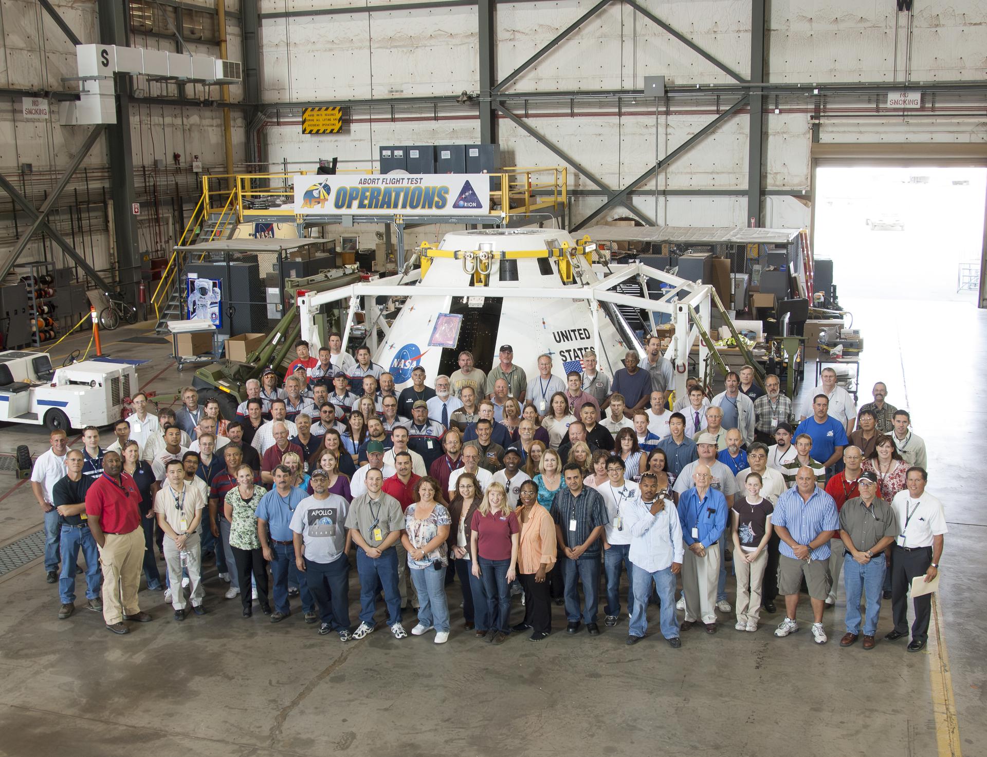 Teamwork was on full display at NASA’s Armstrong Flight Research Center in Edwards, California, on Aug. 13, 2009, as engineers and technicians prepared the Pad Abort-1 vehicle – the Orion launch abort system development test article. After assembly and integration, the mock crew capsule was transported to the U.S. Army’s White Sands Missile Range in New Mexico where it successfully completed its test on May 6, 2010.