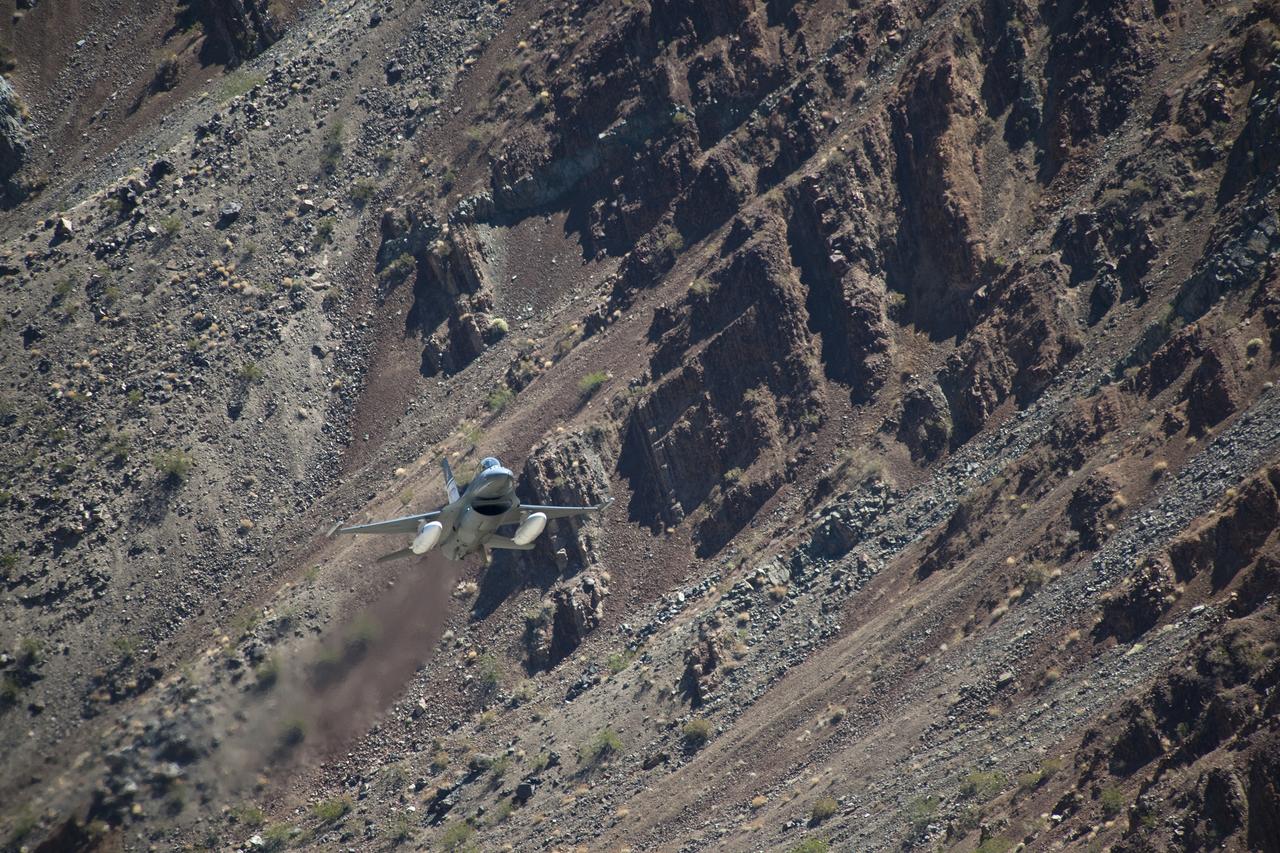The Air Force F-16D Automatic Collision Avoidance Technology aircraft flew at low levels above the Sierra Nevada Mountains to test the ACAT Fighter Risk Reduction Project to develop collision avoidance technologies for aircraft, to reduce the risk of ground collisions.