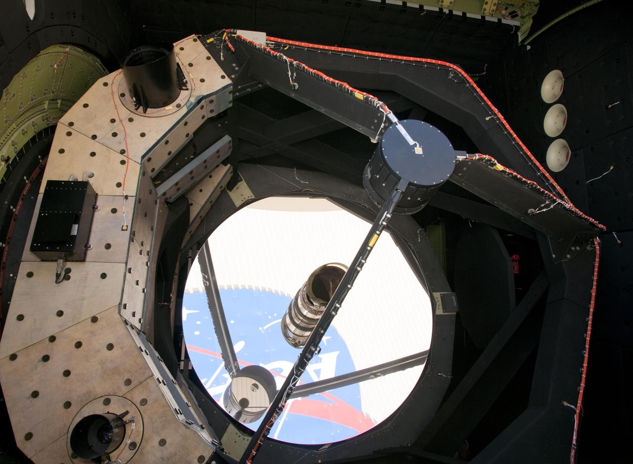 The NASA logo on Bldg. 703 at Armstrong Flight Research Center in Palmdale, Calif., is reflected in the telescope's 2.5-meter primary mirror.