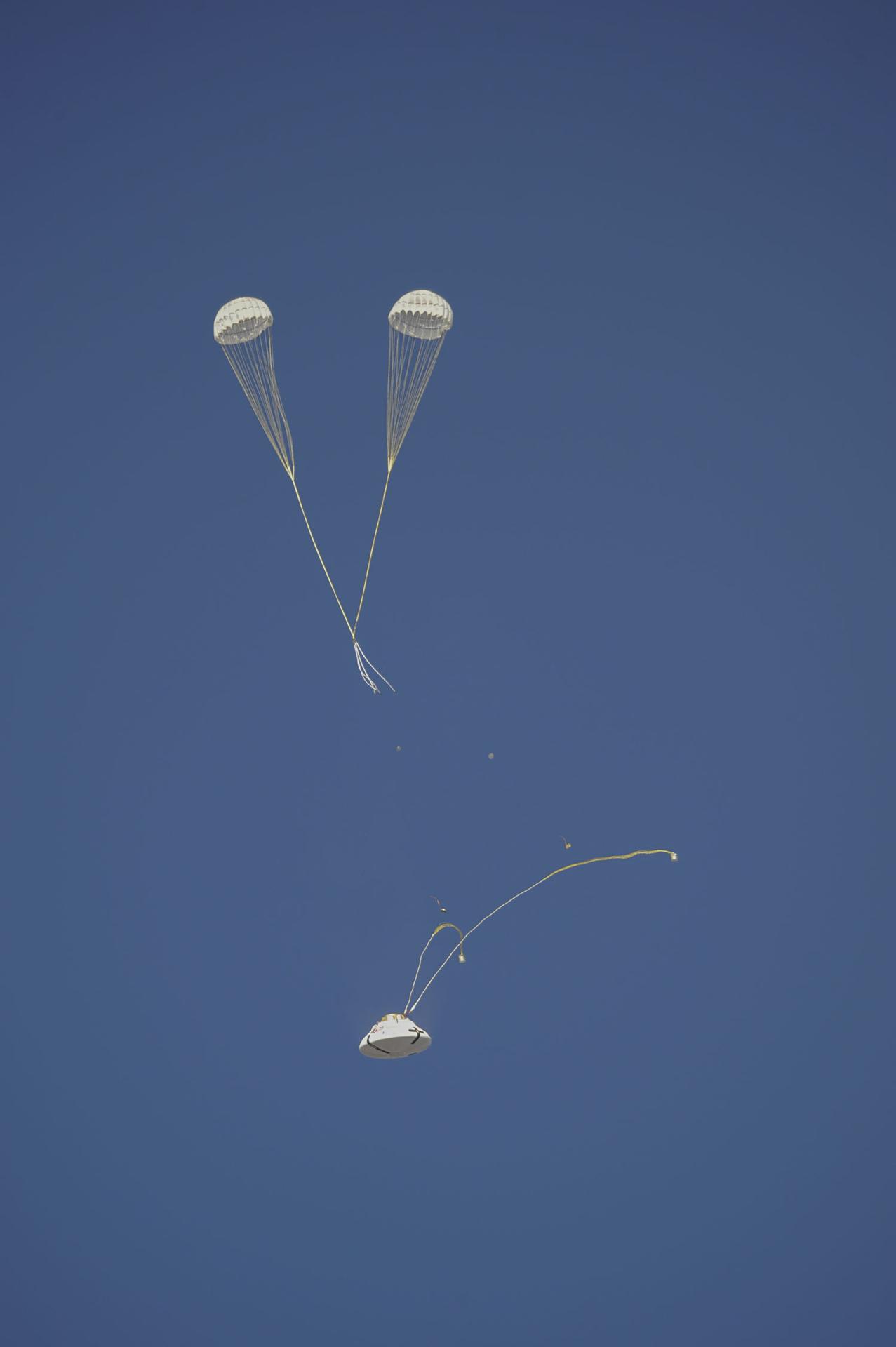 The Orion parachute system enters another phase of its descent after an air launch from a C-17 aircraft on Wednesday, July 18, 2012. Photographers and videographers from NASA’s Armstrong Flight Research Center in Edwards, California, and the agency’s Johnson Space Center in Houston documented a test version of the Orion during Capsule Parachute Assembly System project tests at the U.S. Army Proving Ground, near Yuma, Arizona. 