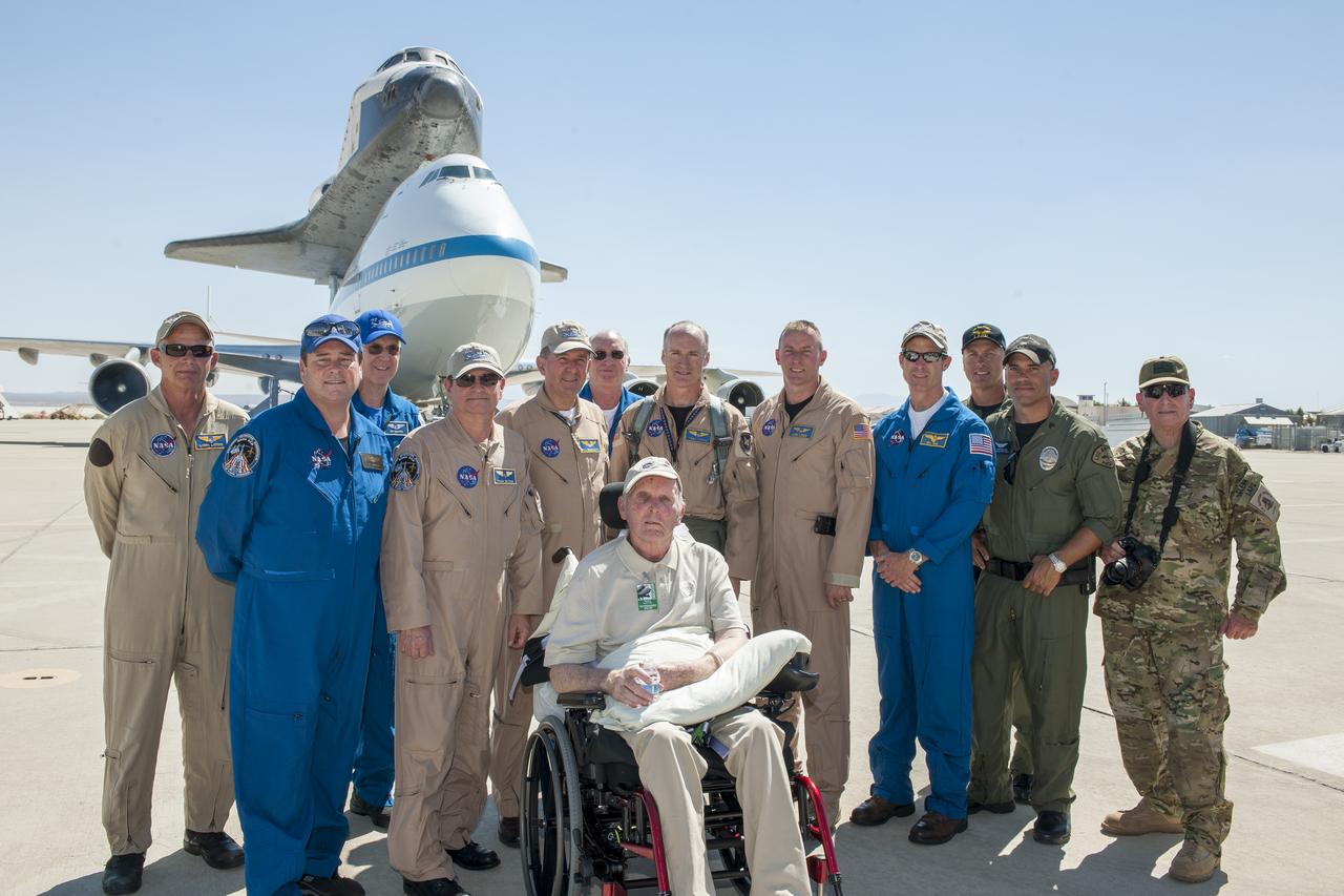 Los Angeles Police Department personnel and former NASA astronaut and NASA Armstrong Flight Research Center (then Dryden) test pilot Gordon Fullerton, seated, join the crew of the NASA 747 Shuttle Carrier Aircraft. Standing is, from left, Larry LaRose, J.J. Johnston, Jeff Moultrie, Frank Batteas, Bill Brockett, Henry Taylor, Troy Asher, Jim Less, Bill Rieke, officer Kevin Standage, Sgt. Stephen Roussell, and Glenn Grossman.