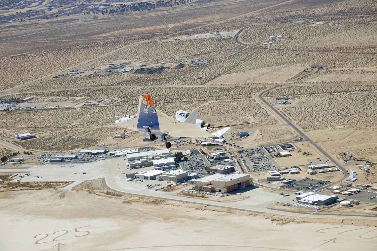 The X-48C Hybrid Wing Body research aircraft banked right over NASA's Dryden Flight Research Center at Edwards, CA during one of the sub-scale aircraft's final test flights on Feb. 28, 2013.