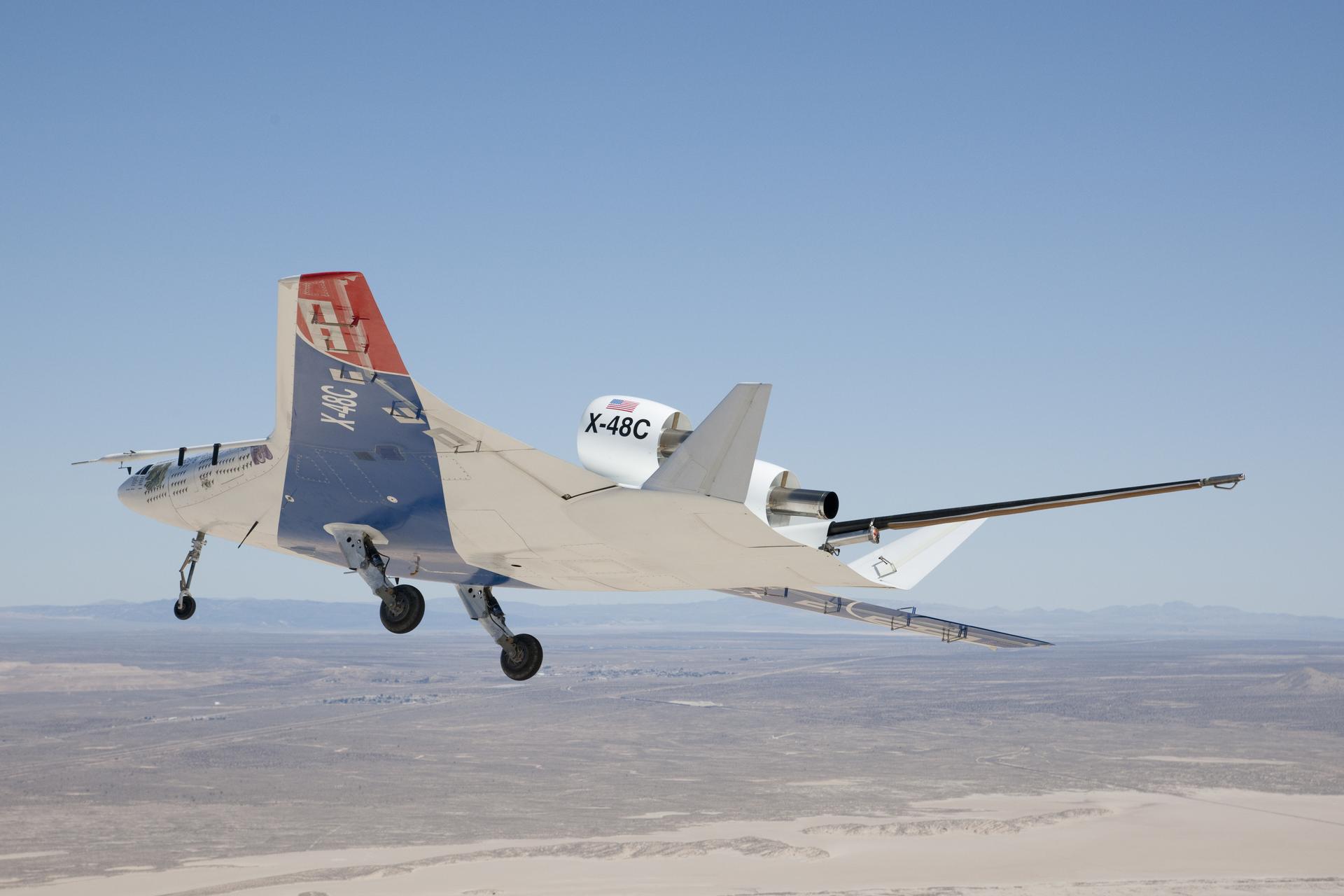 Earth and sky met as the X-48C Hybrid Wing Body aircraft flew over Edwards Air Force Base on Feb. 28, 2013, from NASA's Dryden Flight Research Center, Edwards, CA.