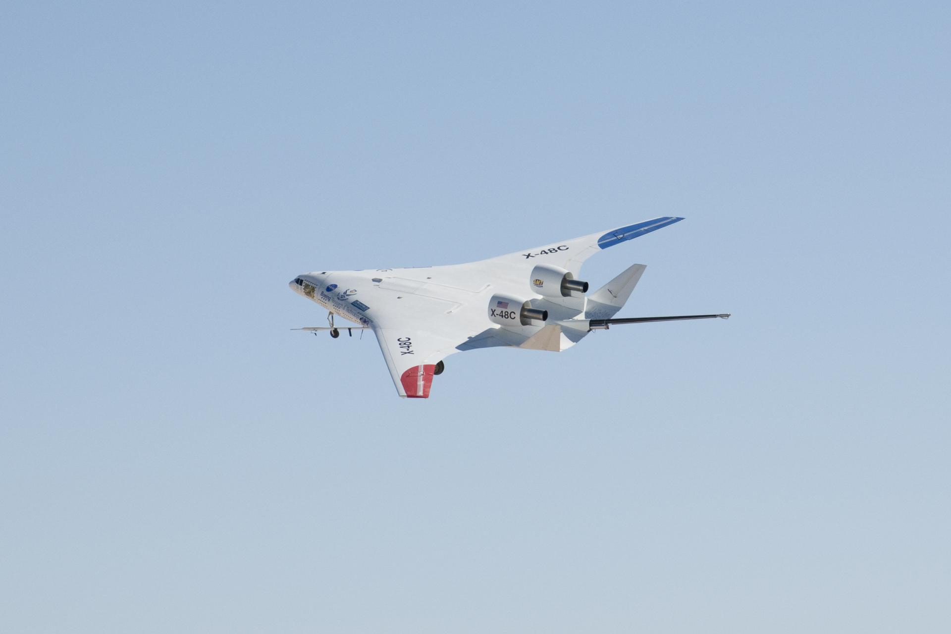 The NASA-Boeing X-48C Hybrid/Blended Wing Body research aircraft banked left during one of its final test flights over Edwards Air Force Base.