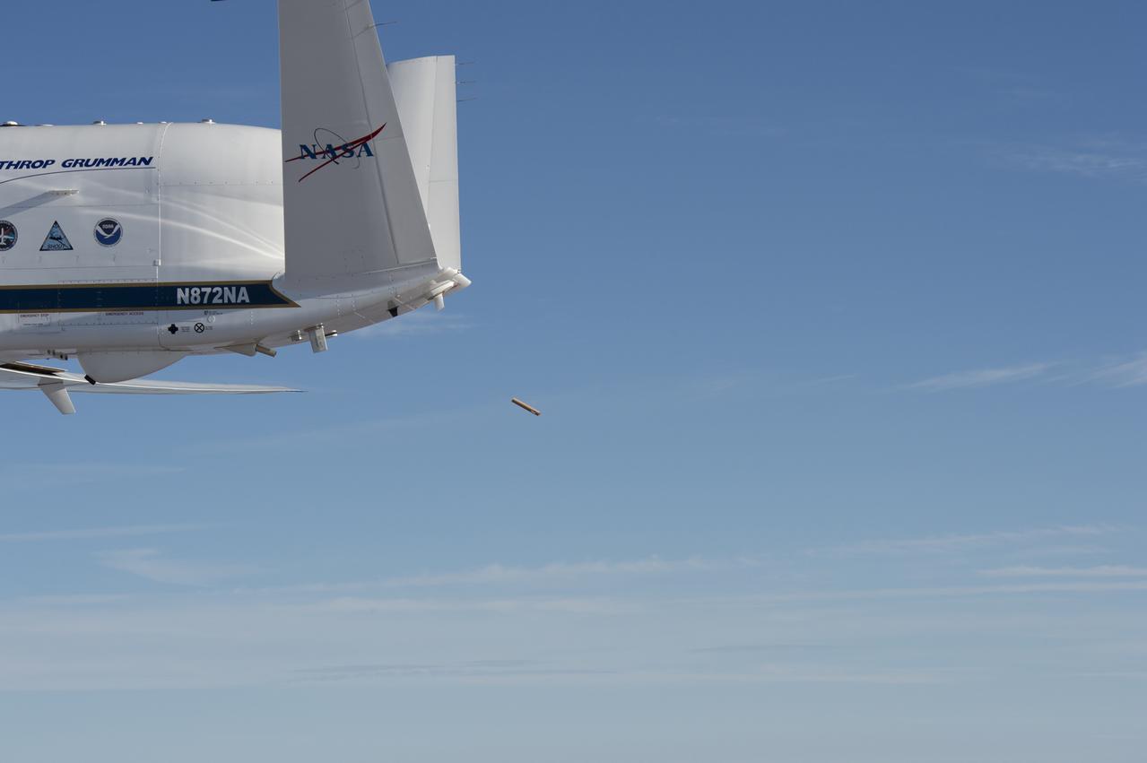 NASA’s Global Hawk aircraft deploys a dropsonde during a test flight over the Dryden Aeronautical Test Range in August 2015. The small, tube-shaped sensor will transmit data on temperature, humidity, and wind speed, which will be used to help improve weather model forecasts