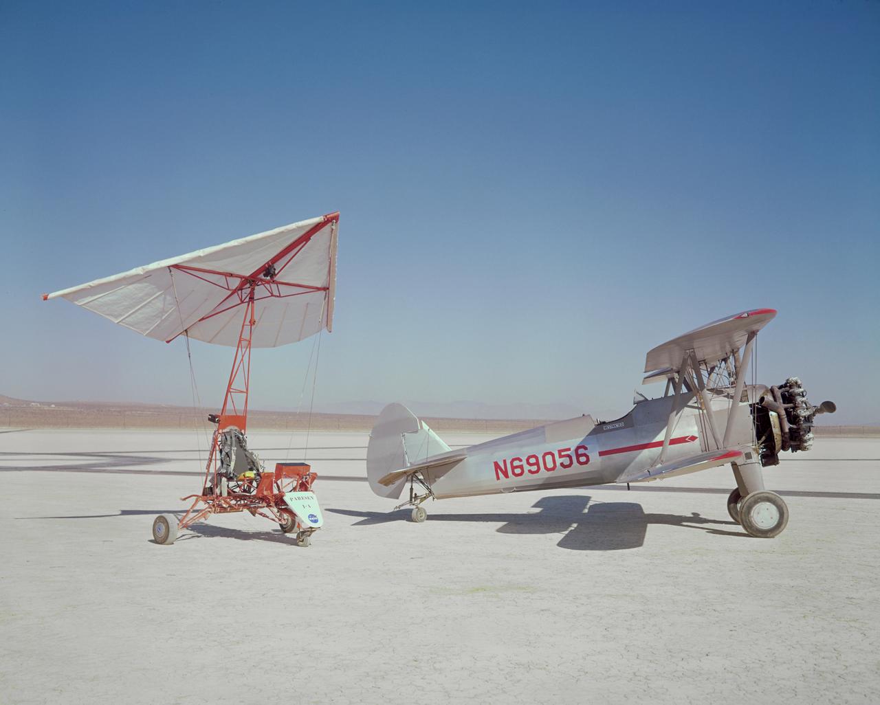 Paresev 1A and Stearman tow plane on lakebed.