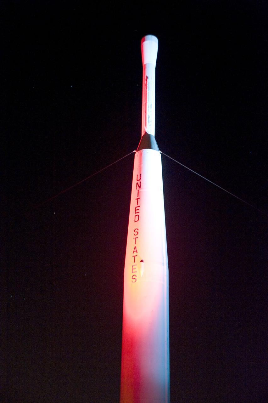 The Delta rocket on display at the Visitor Center at NASA's Goddard Space Flight Center in Greenbelt, Md. The rocket is illuminated as part of a "Yuri's Night" celebration to commemorate the first flight of cosmonaut Yuri Gagarin (April 12, 1961) and the first orbital flight of a space shuttle (April 12, 1981).