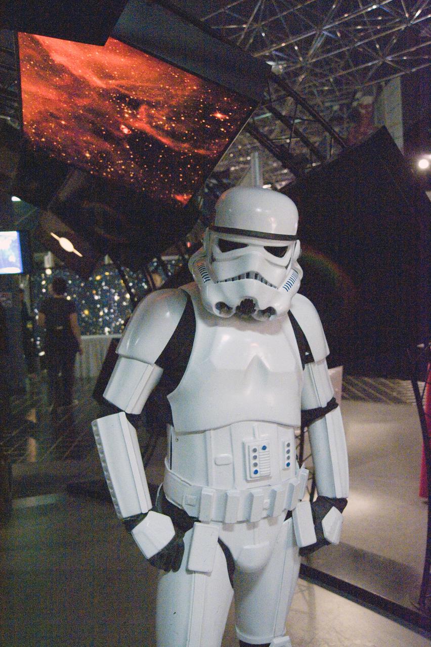 A person cosplays a storm trooper at the Visitor Center at NASA's Goddard Space Flight Center in Greenbelt, Md. Members of the 501st Legion Star Wars cosplaying group attended a "Yuri's Night" celebration to commemorate the first flight of cosmonaut Yuri Gagarin (April 12, 1961) and the first orbital flight of a space shuttle (April 12, 1981).