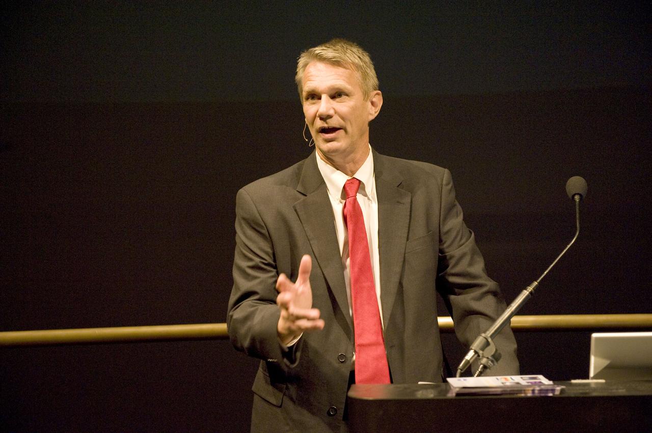 NASA astronaut Piers Sellers at the podium in the IMAX theater at the National Air and Space Museum in Washington, D.C., for an annual reception and presentation with the Maryland Space Business Roundtable.