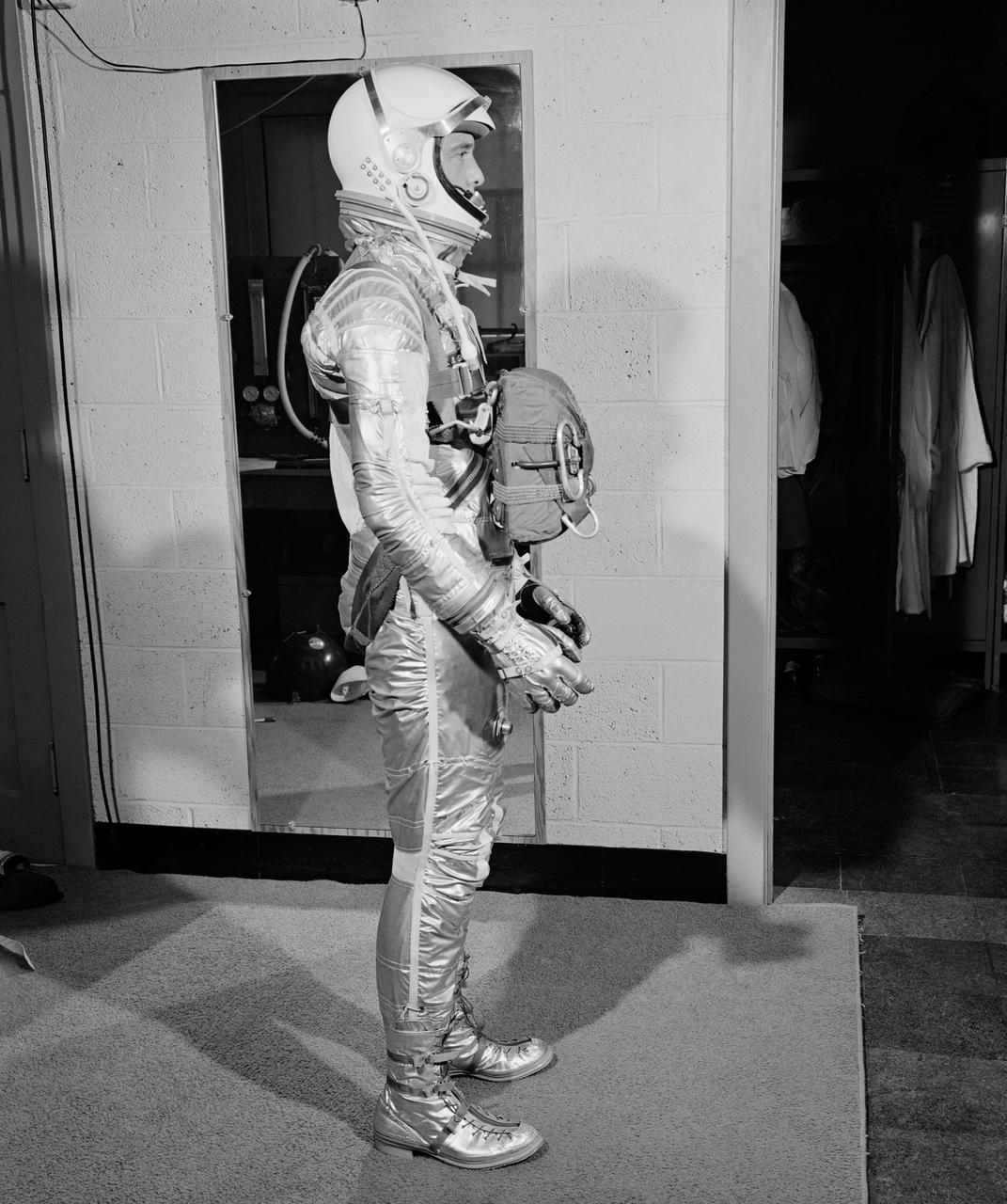 G60-02665 (1960) --- Astronaut Alan B. Shepard Jr., Mercury-Redstone 3 (MR-3) pilot, wearing pressure suit with body parachute. Photo credit: NASA or National Aeronautics and Space Administration