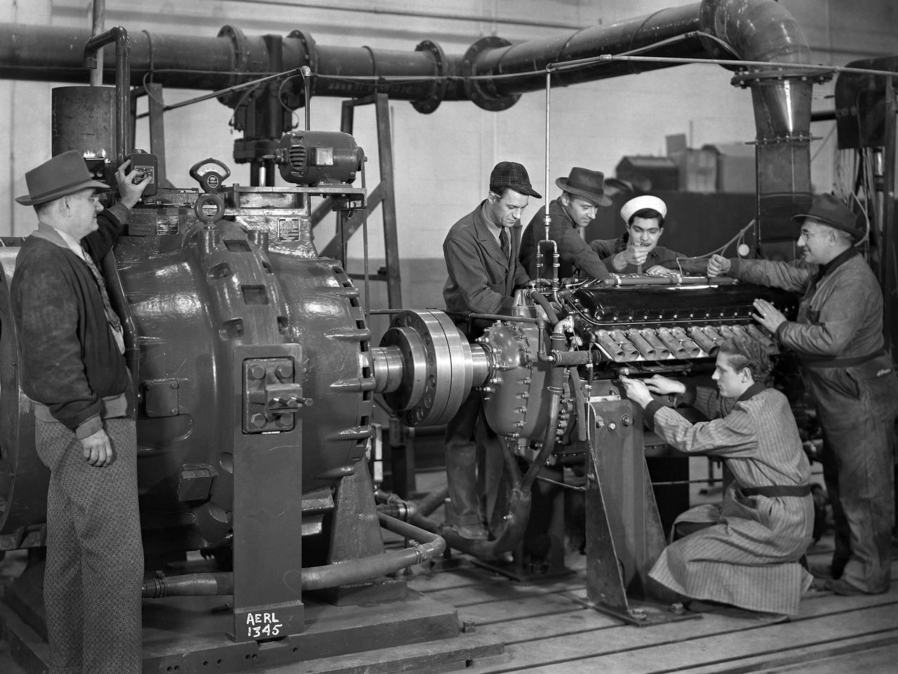 The first research assignment specifically created for the National Advisory Committee for Aeronautics’ (NACA) new Aircraft Engine Research Laboratory was the integration of a supercharger into the Allison V–1710 engine. The military was relying on the liquid-cooled V–1710 to power several types of World War II fighter aircraft and wanted to improve the engine's speed and altitude performance. Superchargers forced additional airflow into the combustion chamber, which increased the engine’s performance resulting in greater altitudes and speeds. They also generated excess heat that affected the engine cylinders, oil, and fuel. In 1943 the military tasked the new Aircraft Engine Research Laboratory to integrate the supercharger, improve the cooling system, and remedy associated engine knock. Three Allison engines were provided to the laboratory’s research divisions. One group was tasked with improving the supercharger performance, another analyzed the effect of the increased heat on knock in the fuel, one was responsible for improving the cooling system, and another would install the new components on the engine with minimal drag penalties. The modified engines were installed on this 2000-horsepower dynamotor stand in a test cell within the Engine Research Building. The researchers could run the engine at different temperatures, fuel-air ratios, and speeds. When the modifications were complete, the improved V–1710 was flight tested on a P–63A Kingcobra loaned to the NACA for this project.