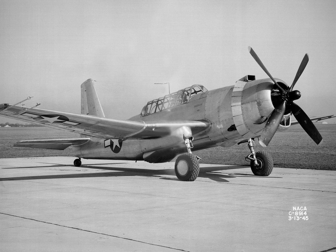 A Bell P-39 Airacobra in the NACA Aircraft Engine Research Laboratory’s Icing Research Tunnel for a propeller deicing study. The tunnel, which began operation in June 1944, was built to study the formation of ice on aircraft surfaces and methods of preventing or eradicating that ice. Ice buildup adds extra weight to aircraft, effects aerodynamics, and sometimes blocks airflow through engines.       NACA design engineers added the Icing Research Tunnel to the new AERL’s original layout to take advantage of the massive refrigeration system being constructed for the Altitude Wind Tunnel. The Icing Research Tunnel is a closed-loop atmospheric wind tunnel with a 6- by 9-foot test section. The tunnel can produce speeds up to 300 miles per hour and temperatures from about 30 to -45⁰ F.   During World War II AERL researchers analyzed different ice protection systems for propeller, engine inlets, antennae, and wings in the icing tunnel. The P-39 was a vital low-altitude pursuit aircraft of the US during the war. NACA investigators investigated several methods of preventing ice buildup on the P-39’s propeller, including the use of internal and external electrical heaters, alcohol, and hot gases. They found that continual heating of the blades expended more energy than the aircraft could supply, so studies focused on intermittent heating. The results of the wind tunnel investigations were then compared to actual flight tests on aircraft.