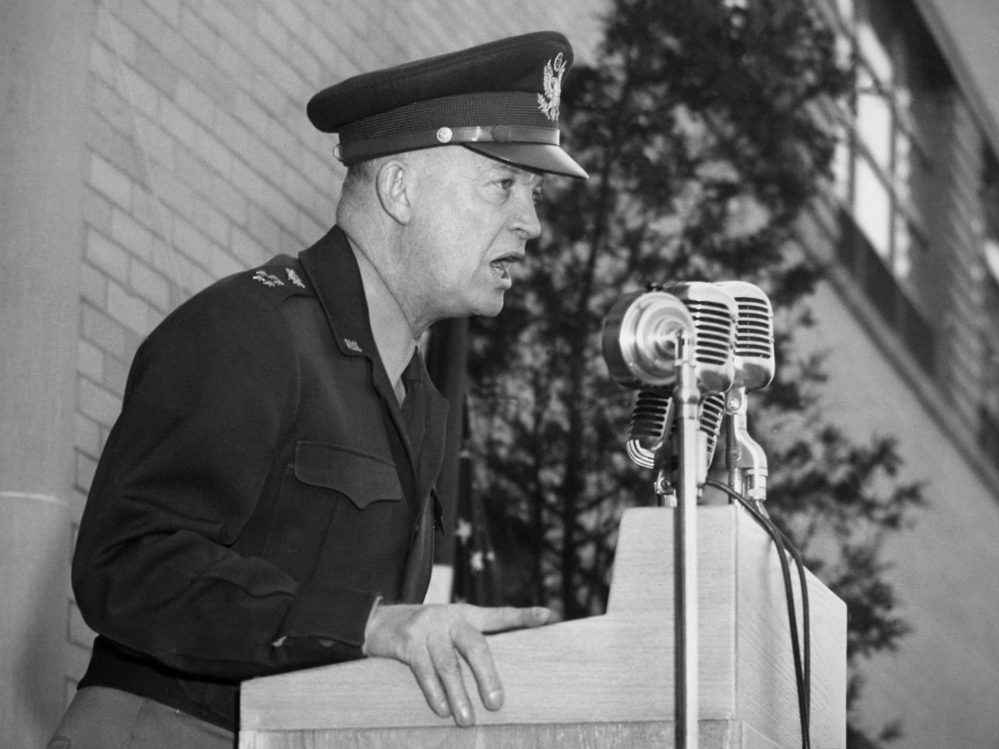 Dwight Eisenhower speaks at a podium