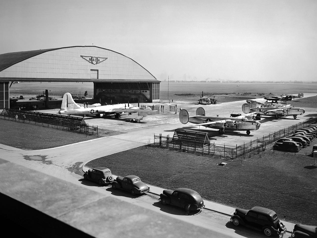 This fleet of military aircraft was used in the 1940s for research at the National Advisory Committee for Aeronautics (NACA) Lewis Flight Propulsion Laboratory in Cleveland, Ohio. The NACA Lewis flight research program was established in March 1943 to augment the lab’s wartime research efforts. NACA Lewis possessed a host of wind tunnels, test stands, and other ground facilities designed to replicate flight conditions, but actual flight tests remained an integral research tool.     The military loaned NACA Lewis 15 different aircraft during World War II and six others in the six months following the end of hostilities. During the war these aircraft supported three main efforts: the improved performance of reciprocating engines, better fuel additives and mixtures, and deicing systems. The wartime researchers used the types of aircraft which the studies were intended to improve. After the war the research aircraft served as test beds to investigate engines or systems that often had little to do with the research aircraft. During the war, NACA Lewis’ three pilots were supported by 16 flight engineers, 36 mechanics, and 10 instrumentation specialists.    The visible aircraft, from left to right, are a Boeing B-29 Superfortress, a Martin B-26A Marauder, two Consolidated B-24 Liberators, a Cessna UC-78 Bobcat, and a Northrop P-61 Black Widow. Partially obscured are a North American P-51 Mustang, a Bell P-63 King Cobra, a North American AT-6 Texan, and a Lockheed RA-29 Hudson.