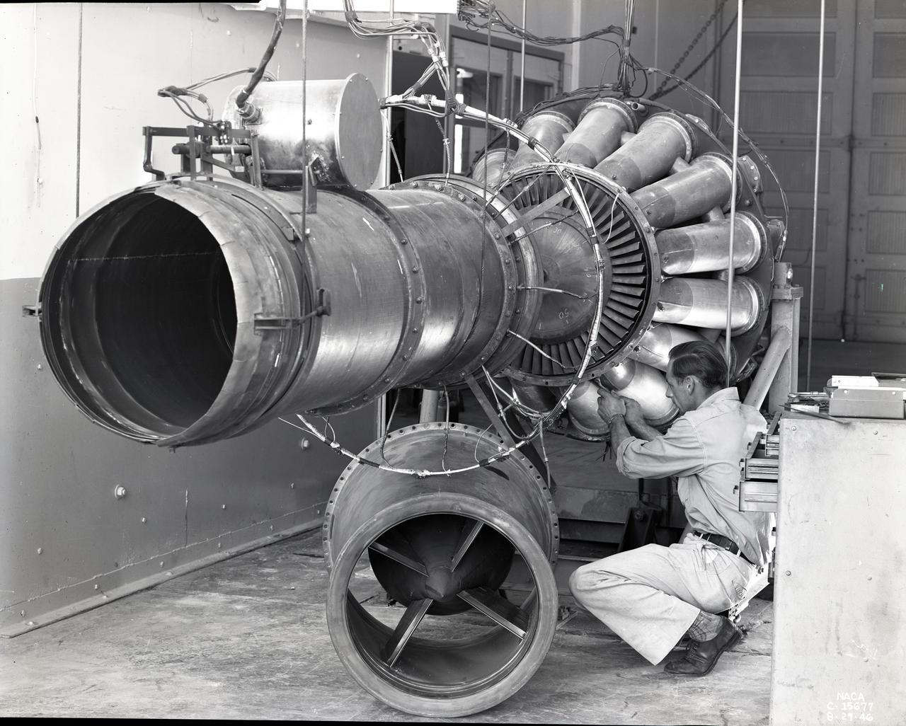 Mechanic prepares a General Electric I-40 turbojet for testing (NASA C1946-15677).