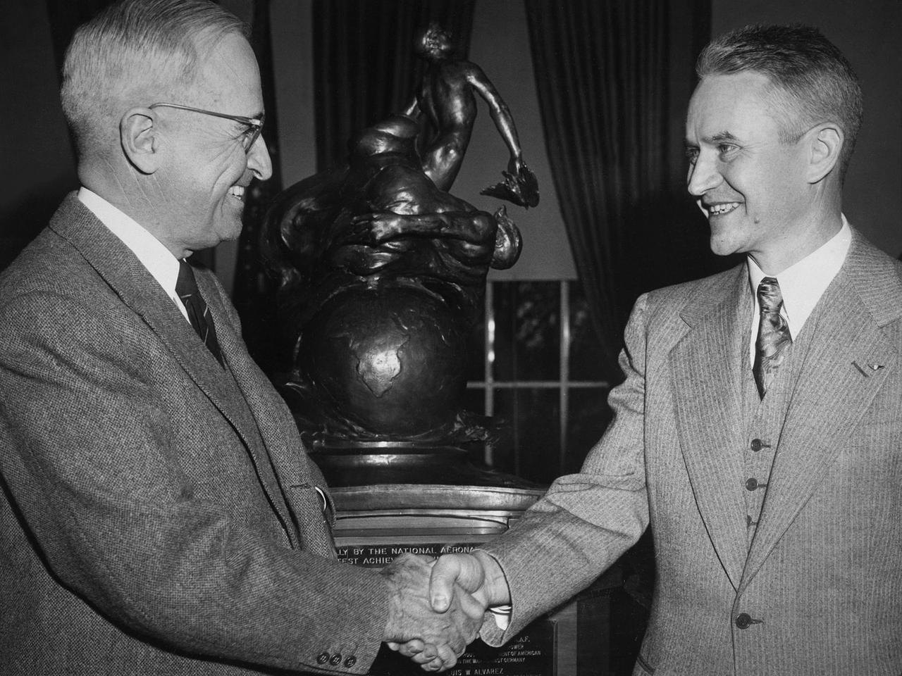 Lewis Rodert, then of the National Advisory Committee for Aeronautics (NACA) Lewis Flight Propulsion Laboratory, receives the Collier Trophy from President Harry Truman for his work in the design and development of an ice prevention system for aircraft. The accumulation of ice on an aircraft had been a critical issue for years. Rodert developed a method of transferring engine heat to the wings and other vulnerable components to prevent ice buildup.    Rodert began his icing investigations at Langley Memorial Aeronautical Laboratory in 1936. The NACA ordered a Lockheed 12A aircraft to be built using Rodert’s deicing system. The aircraft successfully flew through icing conditions during the following winter. Soon thereafter the military incorporated the system into a Consolidated B-24D Liberator and several other military aircraft, including a North American XB-25F.    Rodert and the NACA icing program transferred to the Lewis lab in Cleveland in 1946. In Cleveland, the focus turned to the study of cloud composition and the causes of icing. Rodert’s role at Lewis diminished over the ensuing years. Rodert was honored in 1947 for his Collier Trophy at ceremonies at Langley, Ames, and then finally Lewis.