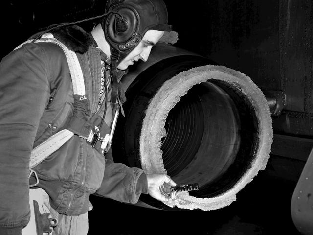 NASA image: NACA Researcher Measures Ice on a Turbojet Engine Inlet