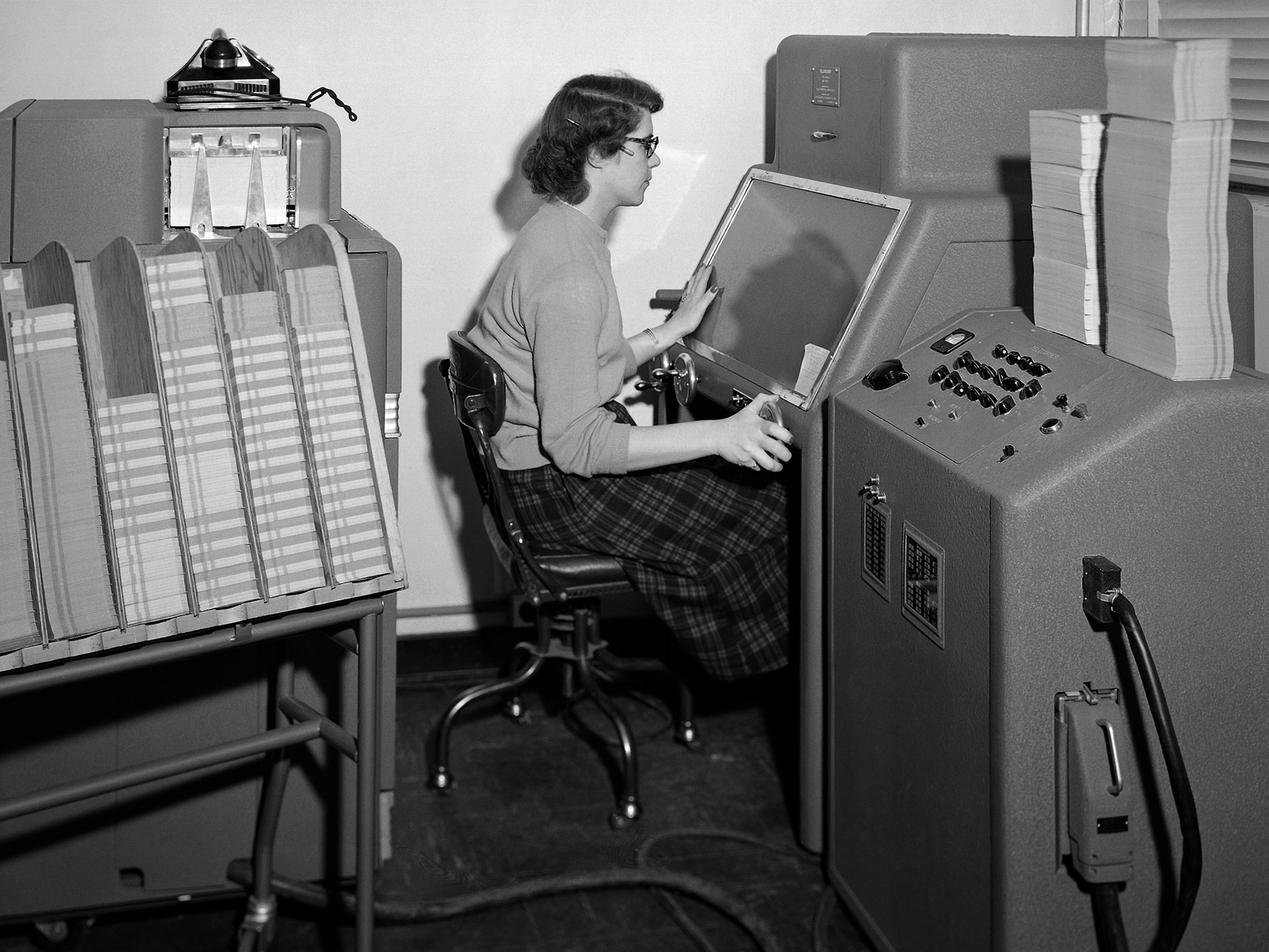 Woman working at a console in 1952