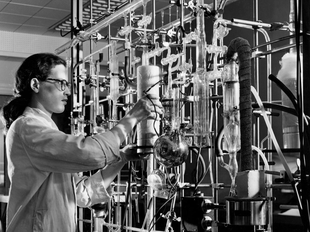 A materials researcher at the NACA’s Lewis Flight Propulsion Laboratory examines a surface crack detection apparatus in the Materials and Stresses Building during December 1952. Materials research was an important aspect of propulsion technology. Advanced engine systems relied upon alloys, and later composites, that were strong, lightweight, and impervious to high temperatures. Jet engines which became increasingly popular in the late 1940s, produced much higher temperatures than piston engines. These higher temperatures stressed engine components, particularly turbines.    Although Lewis materials research began during World War II, the Materials and Thermodynamics Division was not created until 1949. Its primary laboratories were located in the Materials and Stresses Building. The group sought to create new, improved materials and to improve engine design through increased understanding of materials. The Lewis materials researchers of the 1950s made contributions to nickel-aluminum alloys, cermet blades, metal matrix composites, oxide dispersion strengthened superalloys, and universal slopes.