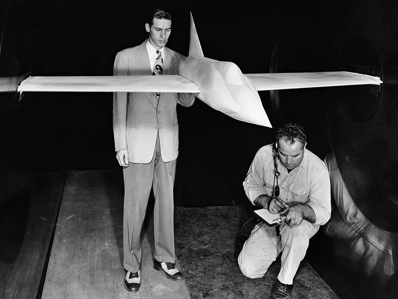 A .10-scale model of Convair’s XF-102 in the 8- by 6-Foot Supersonic Wind Tunnel at the National Advisory Committee for Aeronautics (NACA) Lewis Flight Propulsion Laboratory for jet exit studies. The XF-102 was a prototype of the F-102 Delta Dagger. The F-102 served as an interceptor against long range bombers from the Soviet Union. The aircraft was powered by a Pratt and Whitney J57 turbojet. The first prototype crashed two weeks after is first flight on October 24, 1953, just months after this photograph. Engineers then incorporated the fixed-wing design to reduce drag at supersonic speeds. The production model F-102 became the first delta-wing supersonic aircraft in operation.   The 8- by 6-Foot Supersonic Wind Tunnel is used to study propulsion systems, including inlets and exit nozzles, combustion fuel injectors, flame holders, exit nozzles, and controls on ramjet and turbojet engines. Flexible sidewalls alter the tunnel’s nozzle shape to vary the Mach number during operation. A seven-stage axial compressor, driven by three electric motors that yield a total of 87,000 horsepower, generates air speeds from Mach 0.36 to 2.0.