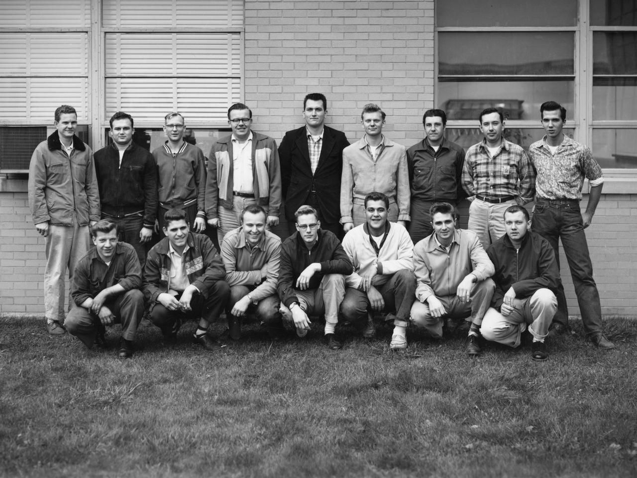 A group of apprentices takes a break from their studies to pose for a photograph at the National Advisory Committee for Aeronautics (NACA) Lewis Flight Propulsion Laboratory. To facilitate the close interaction of the lab’s engineers, mechanics, technicians, and scientists, Lewis Director Ray Sharp established a four-year apprentice program to train craftsmen on a particular trade and basic scientific principles. The apprentice school covered a variety of trades, from aircraft mechanic to electronic instrumentation, machinist, and altitude systems mechanic.     The school was established in 1942, but faltered when over 90 percent of its students entered the military. After World War II, 40 of the original members returned to the NACA lab. In some cases they were bumped to journeymen positions because of training received in the military. The honorary first class in 1949 had only 15 graduates, but the number steadily increased to 45 with the next class in 1952 and to 110 in 1957. There were over 600 graduates by 1969, and the program remained strong for decades. Many of the laboratory’s future managers began their careers as apprentices.    The program, which was certified by both the Department of Labor and the State of Ohio, included classroom lectures, the study of models, and hands-on work. The apprentices rotated through the various shops and facilities to provide them with a well-rounded understanding of the work at the lab.