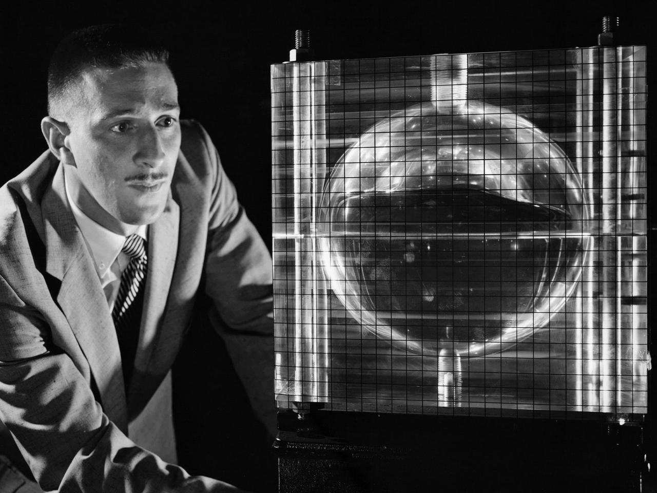 Andy Stofan views a small-scale tank built to study the sloshing characteristics of liquid hydrogen at the National Aeronautics and Space Administration (NASA) Lewis Research Center. Stofan was tasked with the study of propellant motion, or sloshing, in space vehicle propellant tanks. At the time, there was little knowledge of the behavior of fluids in microgravity or the effects of the launch on the propellant’s motion. Sloshing in the tank could alter a spacecraft’s trajectory or move the propellant away from the turbopump. Stofan became an expert and authored numerous technical reports on the subject.    Stofan was assigned to the original Centaur Project Office in 1962 as a member of the Propellant Systems Section. Stofan was instrumental in solving a dynamic instability problem on the Centaur vehicle and served as the systems engineer for the development of the Centaur propellant utilization system. The solution was also applied to the upper-stages of Saturn. In 1966, Stofan was named Head of the Propellant Systems Section.     Stofan continued rising through the managerial ranks at Lewis. In 1967 he became Project Manager of a test program that successfully demonstrated the use of a pressurization system for the Centaur vehicle; in 1969 the Assistant Project Manager on the Improved Centaur project; in 1970 Manager of the Titan/Centaur Project Office; in 1974 Director of the Launch Vehicles Division. In 1978, Stofan was appointed Deputy Associate Administrator for the Headquarters Office of Space Science. In 1982, he was named Director of Lewis Research Center.