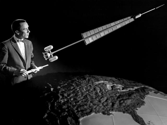 Researcher Poses with a Nuclear Rocket Model