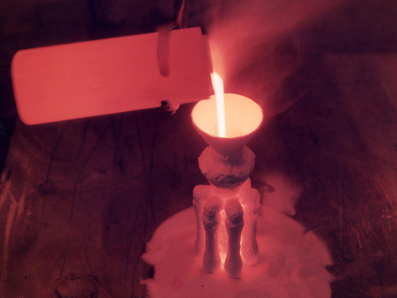 A nickel alloy developed at the National Aeronautics and Space Administration (NASA) Lewis Research Center being poured in a shop inside the Technical Services Building. Materials technology is an important element in the successful development of both advanced airbreathing and rocket propulsion systems. An array of dependable materials is needed to build different types of engines for operation in diverse environments. NASA Lewis began investigating the characteristics of different materials shortly after World War II. In 1949 the materials research group was expanded into its own division. The Lewis researchers studied and tested materials in environments that simulated the environment in which they would operate.    Lewis created two programs in the early 1960s to create materials for new airbreathing engines. One concentrated on high-temperature alloys and the other on cooling turbine blades. William Klopp, Peter Raffo, Lester Rubenstein, and Walter Witzke developed Tungsten RHC, the highest strength metal at temperatures over 3500⁰ F. The men received an IR-100 Award for their efforts. Similarly a cobalt-tungsten alloy was developed by the Fatigue and Alloys Research Branch. The result was a combination of high temperature strength and magnetic properties that were applicable for generator rotor application.    John Freche invented and patented a nickel alloy while searching for high temperature metals for aerospace use. NASA agreed to a three-year deal which granted Union Carbide exclusive use of the new alloy before it became public property.