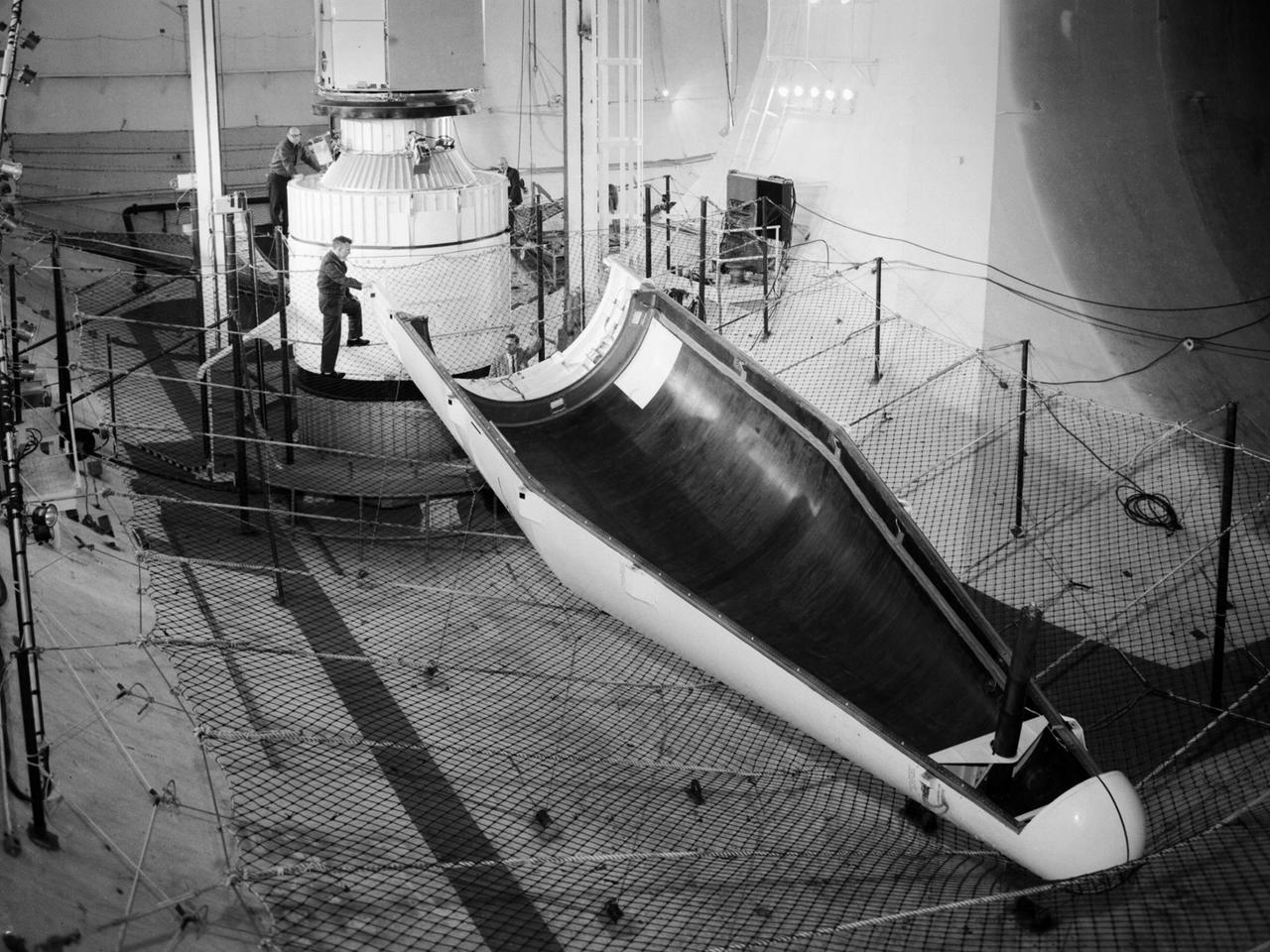 Researchers at the National Aeronautics and Space Administration (NASA) Lewis Research Center conducted a series of shroud jettison tests for the second Orbiting Astronomical Observatory (OAO-2) in the Space Power Chambers during April 1968. The Orbiting Astronomical Observatory satellites were designed by Goddard Space Flight Center to study and retrieve ultraviolet data on stars and galaxies which earthbound and atmospheric telescopes could not view due to ozone absorption.    The shroud jettison system was tested in the Space Power Chambers. In 1961, NASA Lewis management decided to convert its Altitude Wind Tunnel into two large test chambers and later renamed it the Space Power Chambers. The conversion, which took over two years, included removing the tunnel’s internal components and inserting bulkheads to seal off the new chambers. The larger chamber, seen here, could simulate altitudes of 100,000 feet. These chambers were used for a variety of tests on the Centaur second-stage rocket until the early 1970s.     The first OAO mission in 1965 failed due to problems with the satellite. OAO-2 would be launched on an Atlas/Centaur with a modified Agena shroud. The new shroud was 18 feet longer than the normal Centaur payload shrouds. This new piece of hardware was successfully qualified during three tests at 90,000 feet altitude in the Space Power Chambers in April 1968. For the first time, x-rays were used to verify the payload clearance once the shroud was sealed. OAO-2 was launched on December 7, 1968 and proved to be an extremely successful mission.