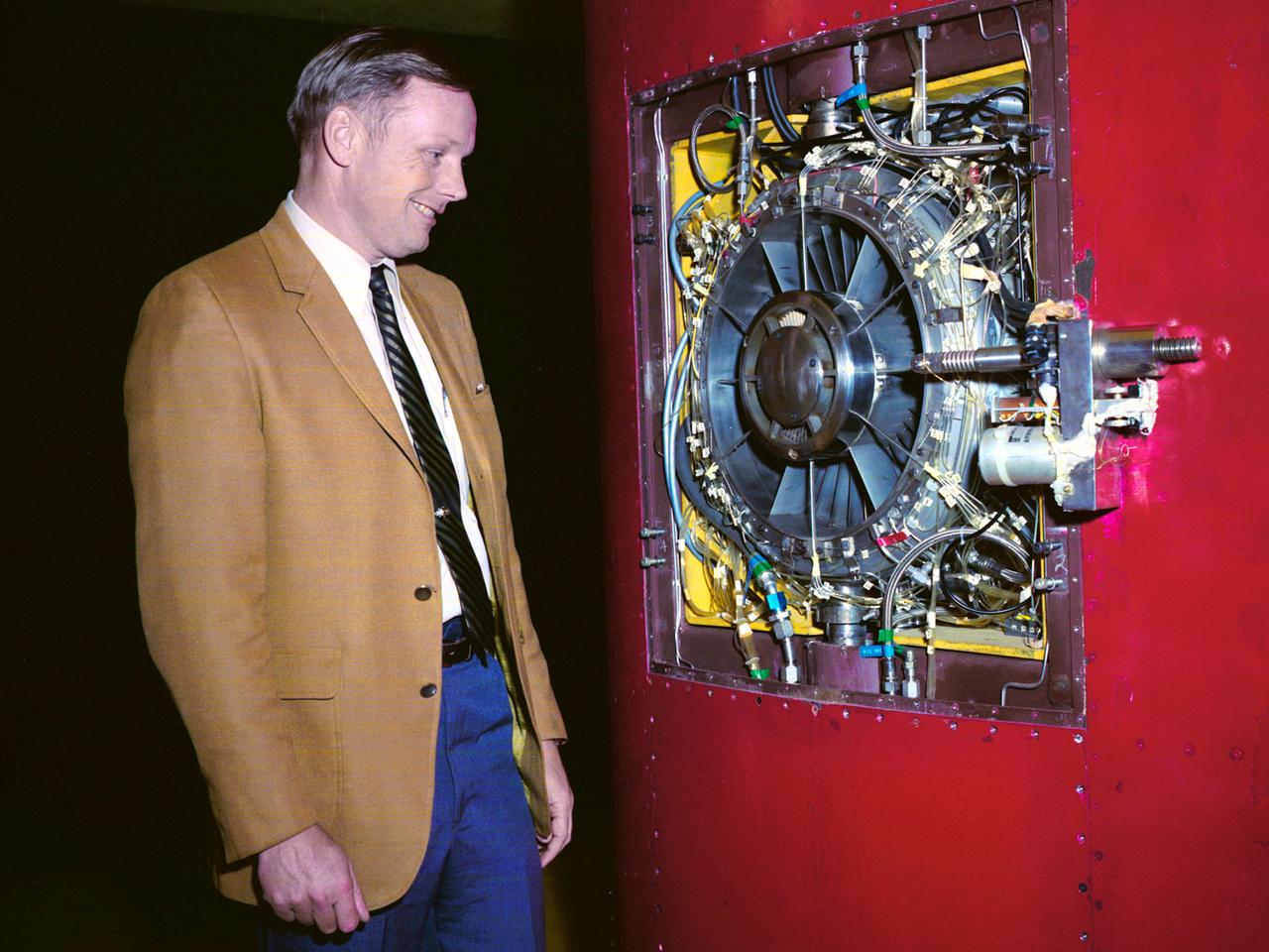 Astronaut Neil Armstrong examines a Vertical and Short Takeoff and Landing test setup in the 9- by 15-Foot Low Speed Wind Tunnel at the National Aeronautics and Space Administration (NASA) Lewis Research Center. Armstrong spent February 6, 1970 at Lewis attending technical meetings and touring some facilities. Just six months after Armstrong had returned from the moon looming agency budget cuts were already a concern in his comments. He noted that NASA had to “find a balanced approach…and [make] aggressive use of available facilities.”    Armstrong spent four months at the center as a research pilot in 1955. Armstrong had served as a Navy pilot during the Korean War then earned a degree in aeronautical engineering at Purdue University. He was recruited by Lewis while at Purdue and began at the center shortly after graduation. During his brief tenure in Cleveland Armstrong served as both a test pilot and research engineer, primarily involved with icing research. In his role as research pilot Armstrong also flew a North American F-82 Twin Mustang over the ocean near Wallops Island to launch small instrumented rockets from high altitudes down into the atmosphere to obtain high Mach numbers. After four months in Cleveland a position opened up at what is today the Dryden Flight Research Center. Armstrong’s career in Cleveland officially ended on June 30, 1955.