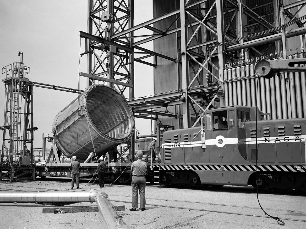 A section of the Centaur Standard Shroud transported to Nuclear Rocket Dynamics and Control Facility, or B-3 Test Stand, at the National Aeronautics and Space Administration’s (NASA) Plum Brook Station. B-3 was built in the early 1960s to test full-scale liquid hydrogen fuel systems in simulated altitude conditions. The facility was used in 1972, however, for testing of the Centaur Standard Shroud’s ejection system.   In the late 1960s NASA engineers were planning the ambitious new Viking mission to send two rover vehicles to the surface of Mars. The Viking rovers were the heaviest payloads ever attempted and were over three times the weight of Atlas-Centaur’s previous heaviest payload. Consequently, NASA engineers selected the more powerful the Titan III rocket booster to mate with the Centaur. Concurrently, General Dynamics was in the process of introducing a new Centaur model for Titan—the D-1T. The biggest change for the D-1T was a completely new shroud designed by Lockheed, called the Centaur Standard Shroud. The shroud, its insulation, the Centaur ground-hold purge system, and the hydrogen tank venting system were all studied in B-3.    After more than two years of preparations, the tests were run between April and July 1973. The tests determined the ultimate flight loads on two axes, established the Centaur’s load sharing, the level of propellant boiloff during launch holds, and the vent system capacity. The Centaur Standard Shroud performed flawlessly during the August 20 and September 9, 1975 launches of Viking 1 and 2.