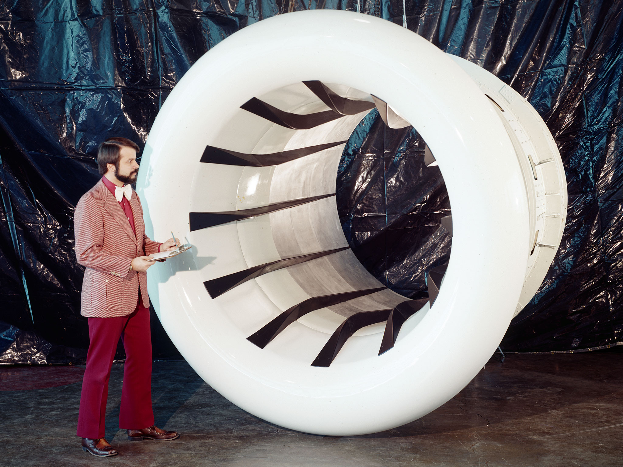 Brent Miller poses with a sonic inlet for the NASA Quiet Engine Program in 1974