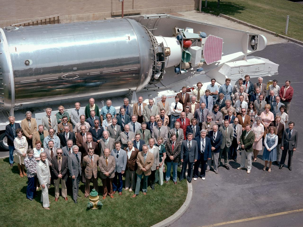 The National Aeronautics and Space Administration (NASA) Lewis Research Center’s Launch Vehicle Directorate in front of a full-scale model of the Centaur second-stage rocket. The photograph was taken to mark Centaur’s fiftieth launch. NASA Lewis managed the Centaur Program since 1962. At that time, the only prior launch attempt ended in failure. Lewis improved the spacecraft and tested it extensively throughout the early 1960s. In May 1966 an Atlas-Centaur sent the Surveyor spacecraft to the moon. It was the first successful soft landing on another planet.     The Launch Vehicles Division was formed in 1969 to handle the increasing number of Centaur launches. The Lewis team became experts at integrating the payload with the Centaur and calculating proper trajectories for the missions.    Centaur’s first 50 missions included Orbiting Astronomical Observatories, the Mariner 6 and 7 flybys of Mars, Mariner 9 which was the first spacecraft to orbit around another planet, the Pioneer 10 and 11 missions to the outer solar system, the Mariner 10 flyby of Venus and Mercury, the Viking 1 and 2 Mars landers, Voyagers 1 and 2 missions to Jupiter, Saturn, Uranus, and Neptune, and the Pioneer 12 and 13 flights to Venus.