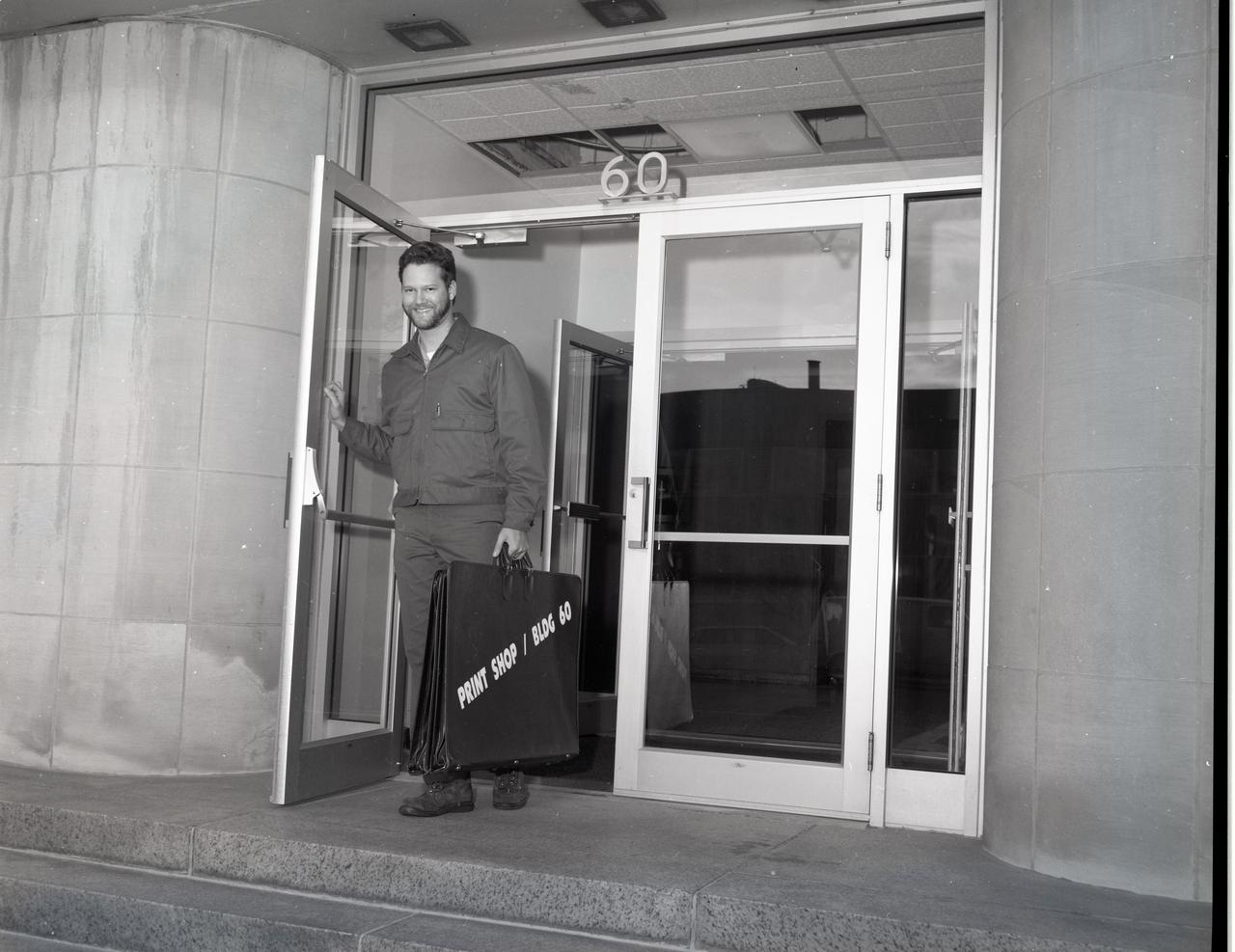Cortez III Employee Delivers Work Between the Print Shop and the Building 60 Graphics Department