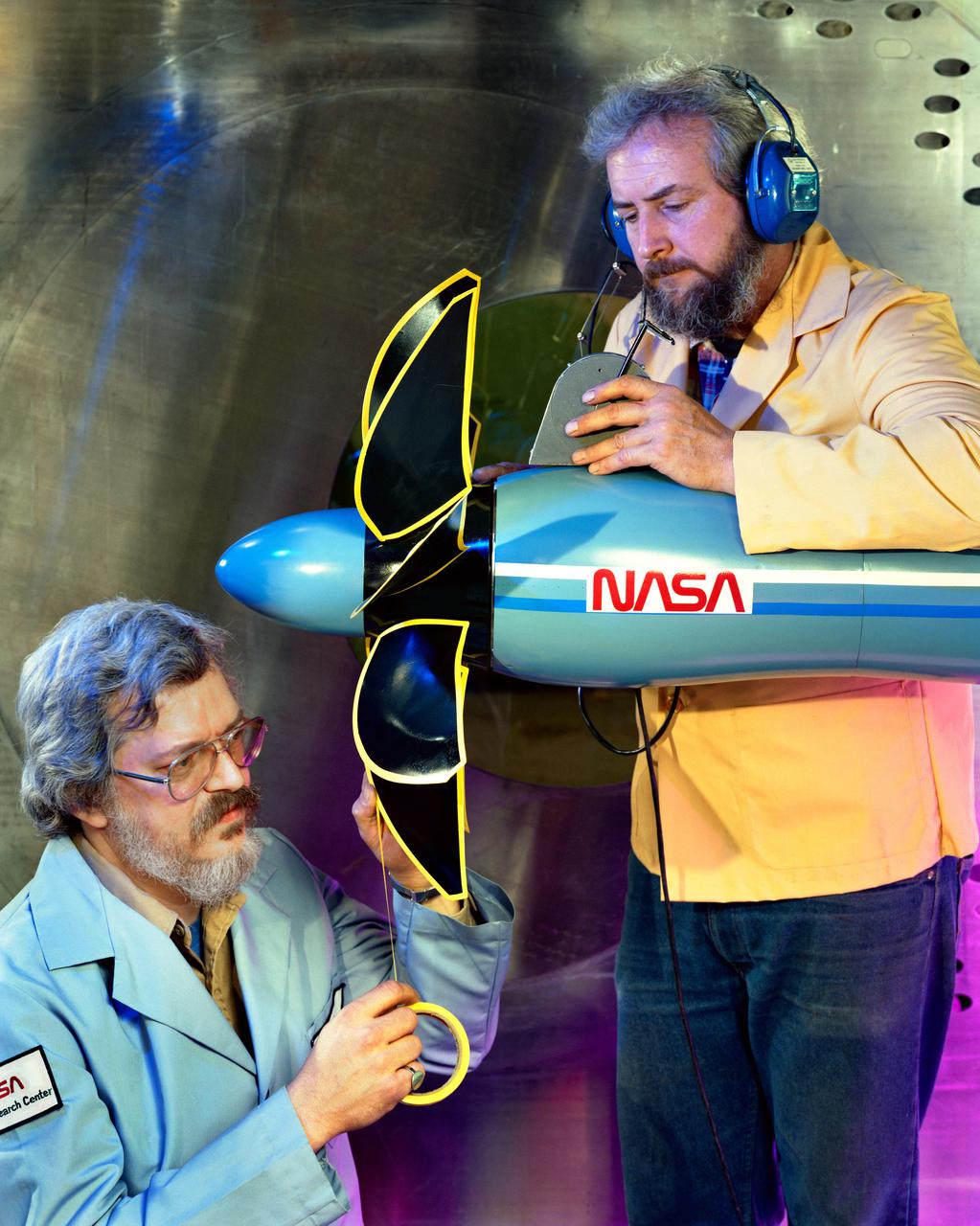 Technicians ready a single rotating propeller model in the 8x6 Supersonic Wind Tunnel