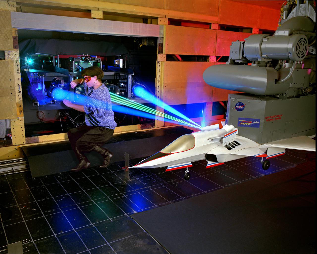 The 9x15 low speed tunnel tests take off and landing of aircraft.  The laser velocimetry system for flow measurement show here, with the color blue and green lasers, measures engine exhaust that comes back up from the ground.  The STOVL model n the 9x15 low speed wind tunnel, building 39, is similar to the British Harrier aircraft.
