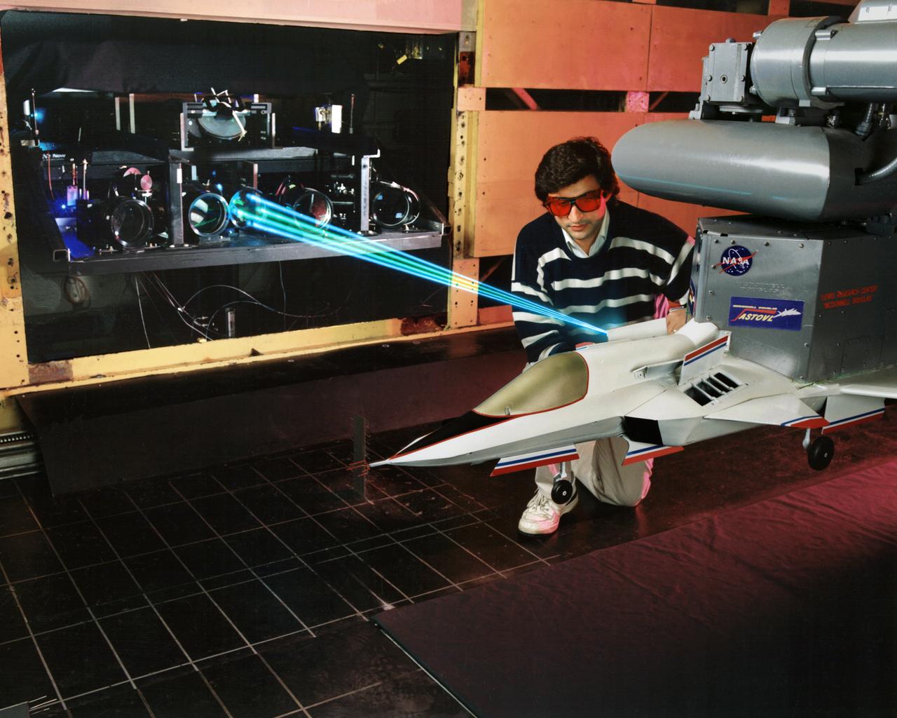 A spectrally resolved Rayleigh/Mie scattering diagnostic was developed to measure temperature and wing span wise velocity in the vicinity of an ASTOVL aircraft model tested in the Lewis, now Glenn, 9x15 Low Speed Wind Tunnel. Shown is a Fabry-Perot interferometer that uses only the blue light from a laser to measure static temperature and velocity near the lift nozzles and suction systems.