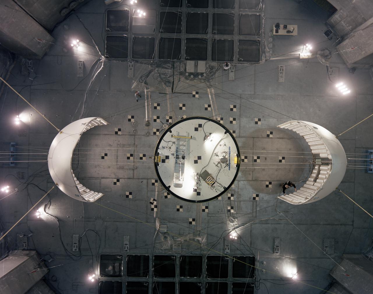 Top down photograph showing separation of the Ariane V fairing after testing in the vacuum chamber at SEC