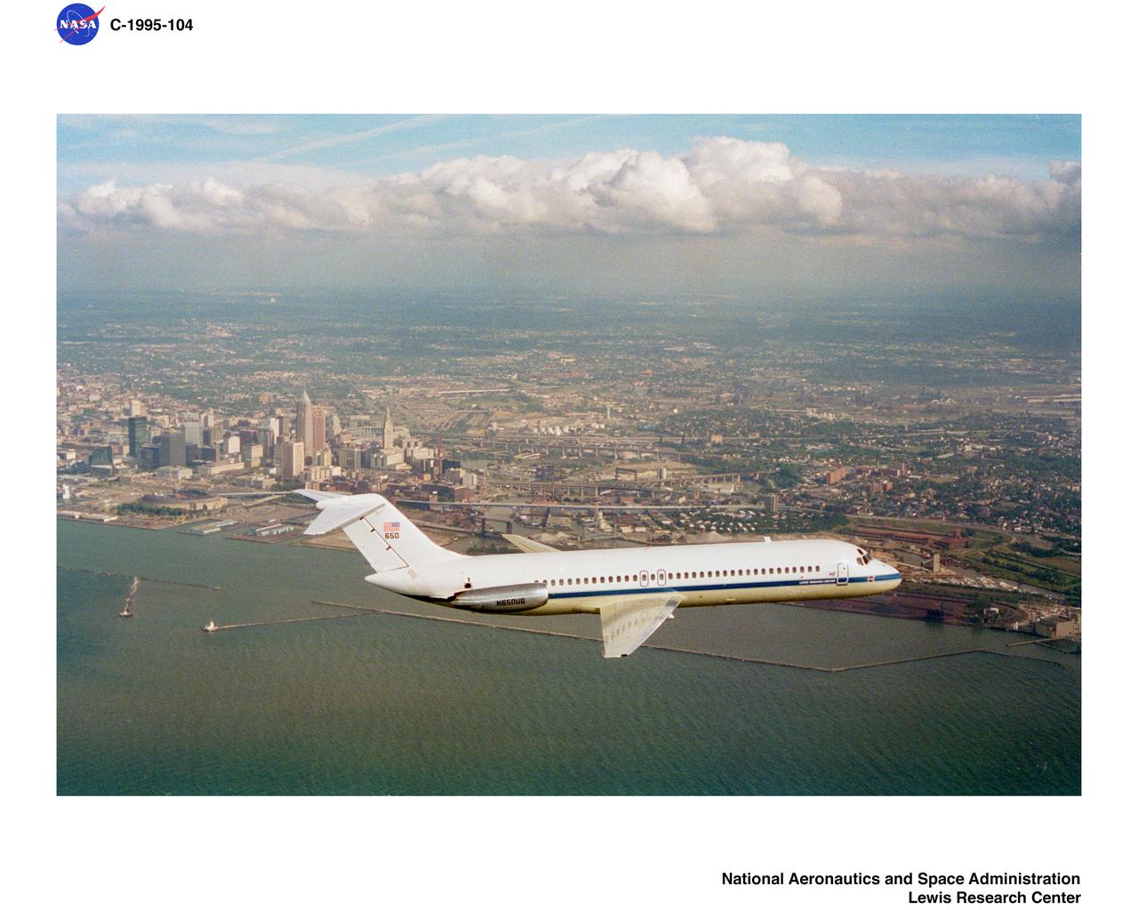 DC-9 AIRPLANE FLYING OVER CLEVELAND OHIO SEPTEMBER 23 1994