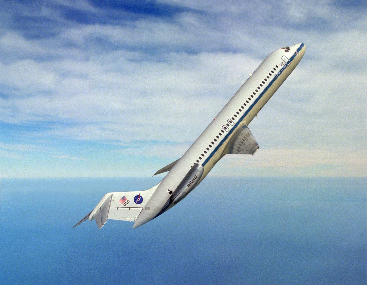 DC-9 AIRPLANE IN FLIGHT AT 50 DEGREES ANGLE OVER HORIZON