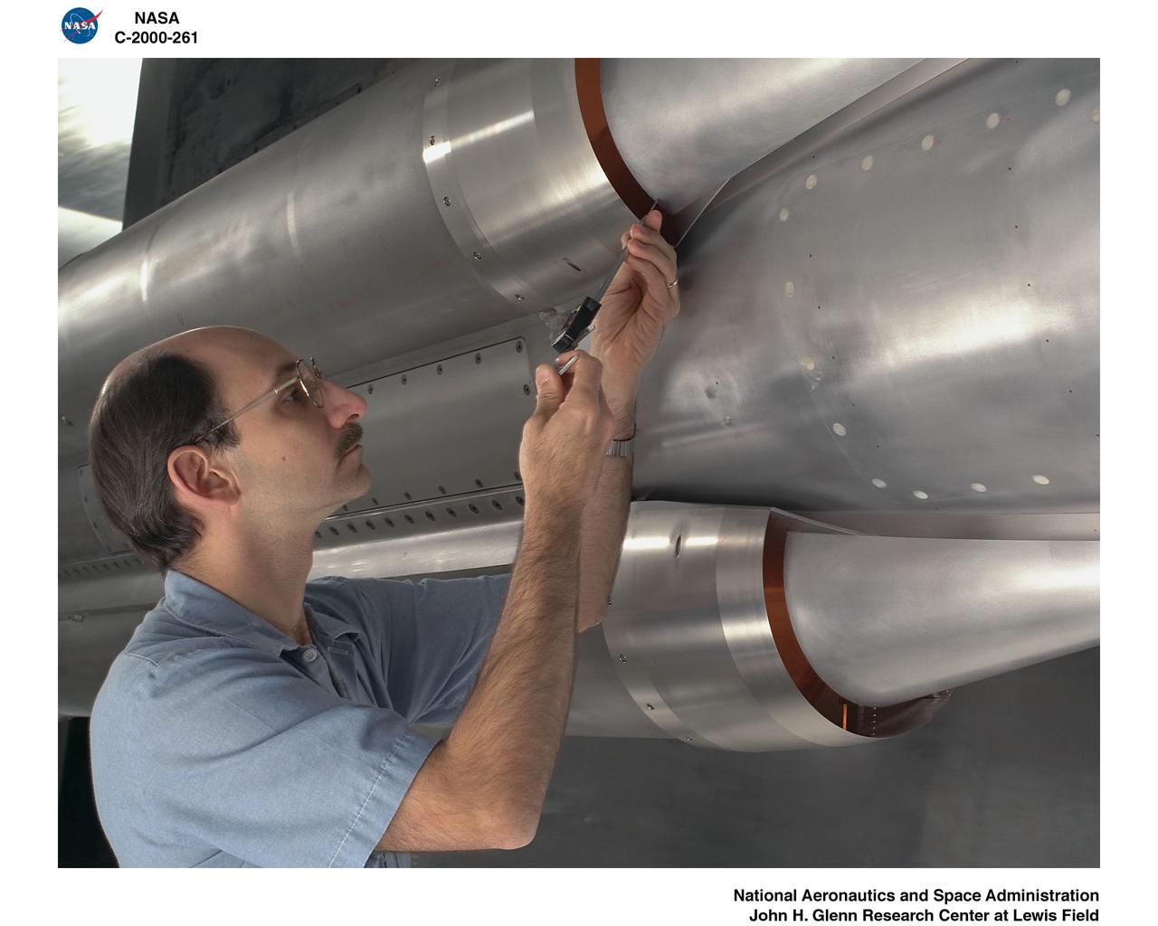 DAN KOVACH WORKING ON THE ROCKET BASED COMBINED CYCLE RIG 3.1 MODEL IN THE 10X10 FOOT SUPERSONIC WIND TUNNEL