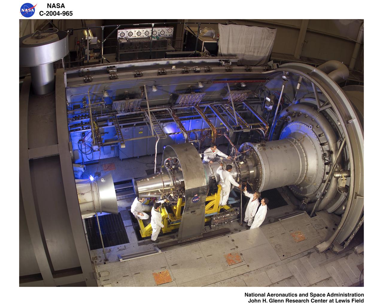 Jet engine being set up for testing with technicians from Propulsion System lab PSL