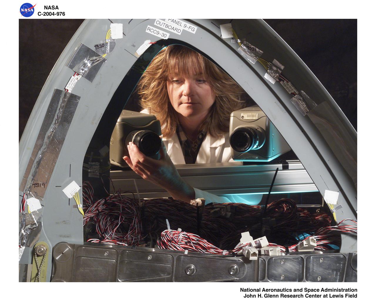 Adrienne Veverka performing Aramis System setup with Orbiter Enterprise fiberglass leading edge Panel 9L