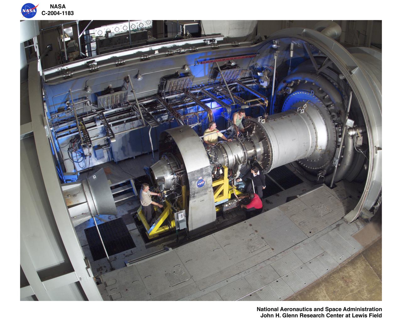 Gary Klann, Greg Hill, Eric Roessler, Queito Thomas, Joyel Schaefer prepare an engine for testing in the NASA Glenn Research Center's Propulsion Systems Laboratory
