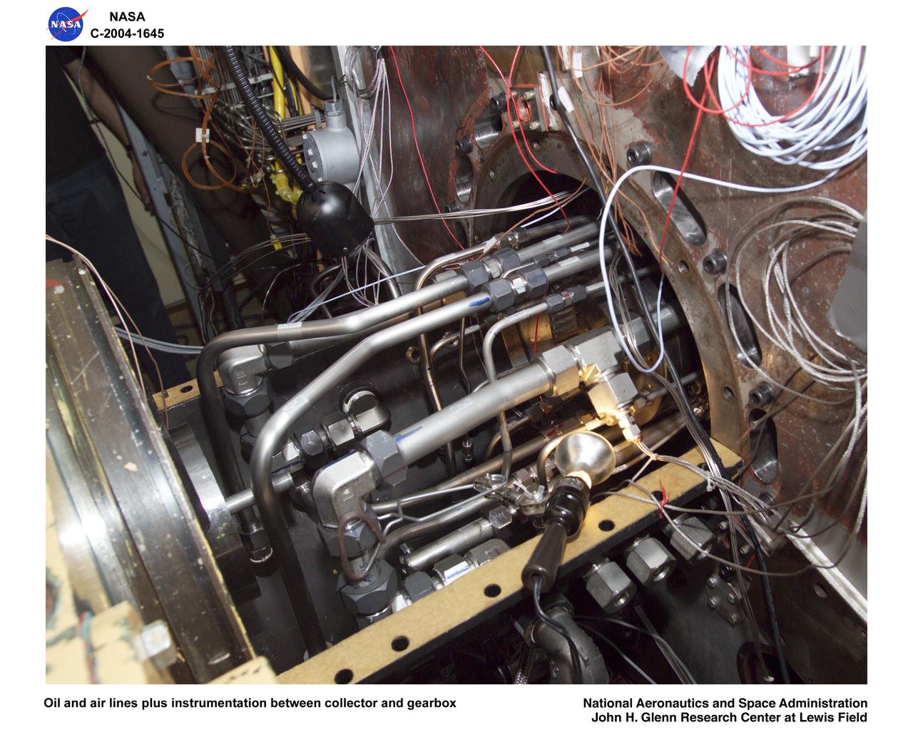 Ultra-Efficient Engine Technology  (UEET), Proof of Concept Compressor, Advanced Compressor Casing Treatment testing; oil and air lines plus instrumentation between collector and gearbox